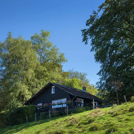 Open Wooden Chalet Built Against A Hill Chalet
