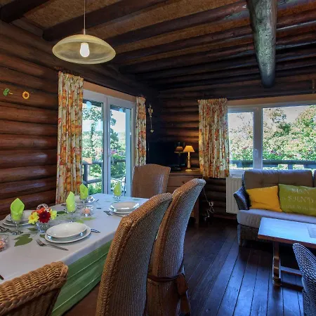 Open Wooden Chalet Built Against A Hill