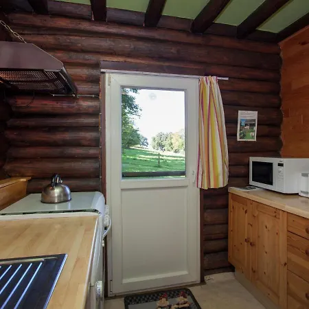 Open Wooden Chalet Built Against A Hill Chalet
