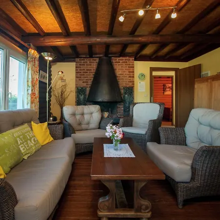 Open Wooden Chalet Built Against A Hill