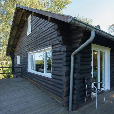 Open Wooden Chalet Built Against A Hill *